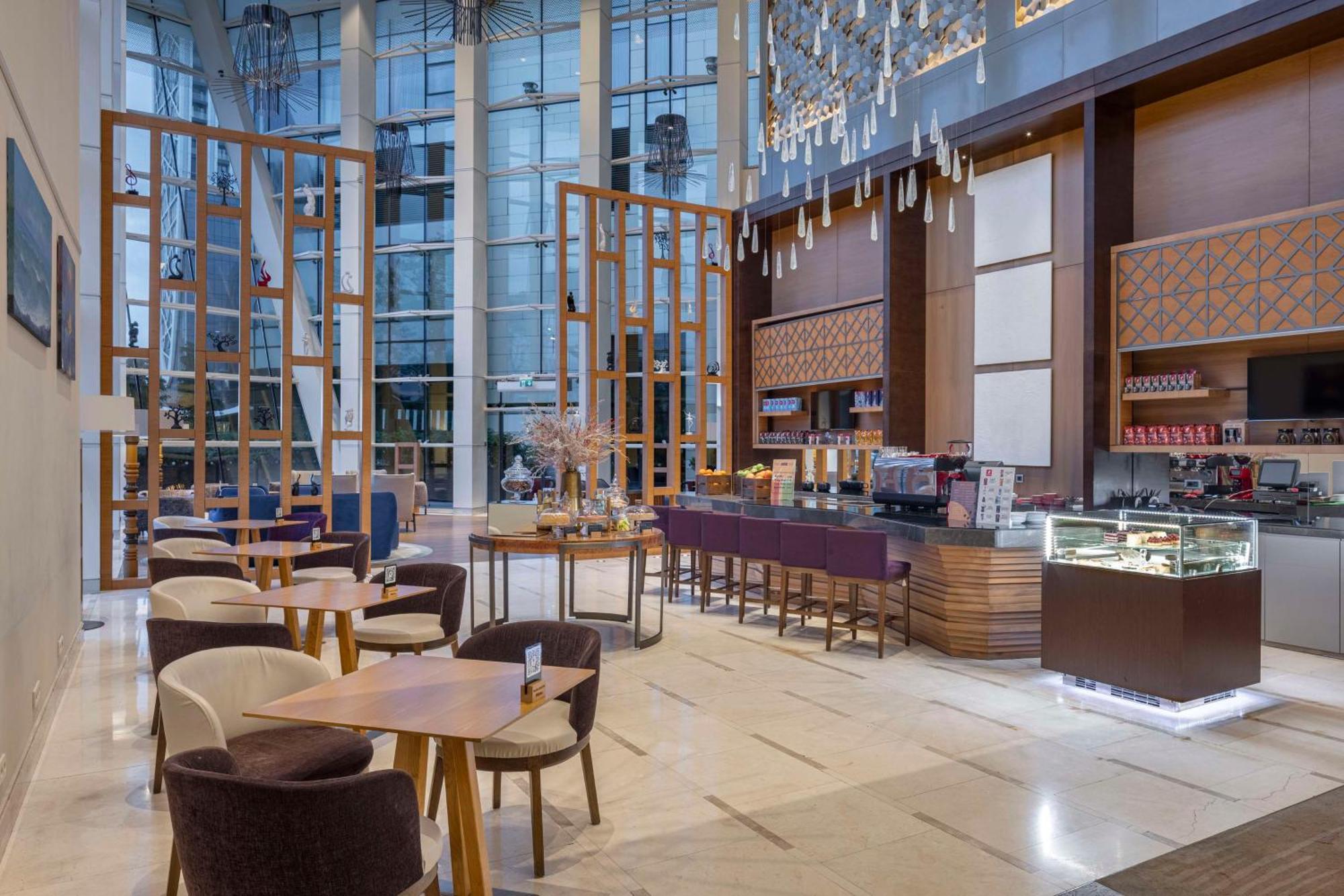 Hilton Batumi Hotel Exterior photo The Lounge at the airport